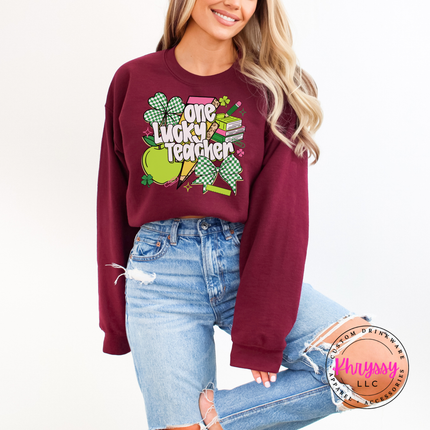 Maroon cozy crewneck styled with a festive lucky teacher graphic.