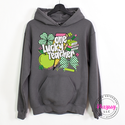 Charcoal pullover hoodie with a colorful one lucky teacher shamrock print.