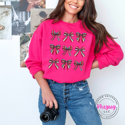 Heliconia crewneck sweatshirt showing a coquette patriotic flag-bow grid print.