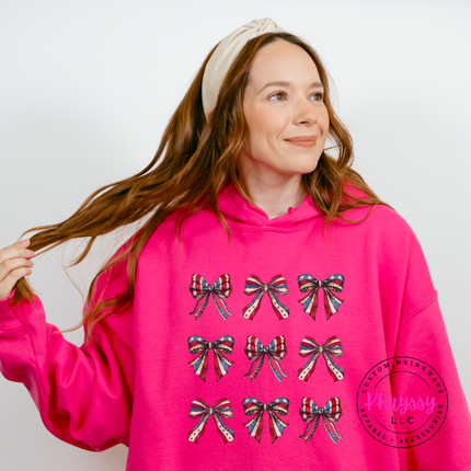Heliconia crewneck sweatshirt showing a coquette patriotic flag-bow grid print.