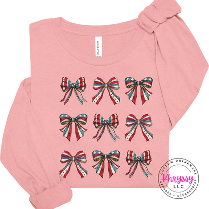 Pink long sleeve tee with a grid of vintage American flag bows.
