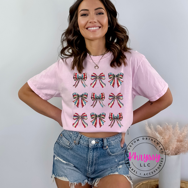 Blossom garment-dyed tee with a patriotic American flag-bow grid graphic.