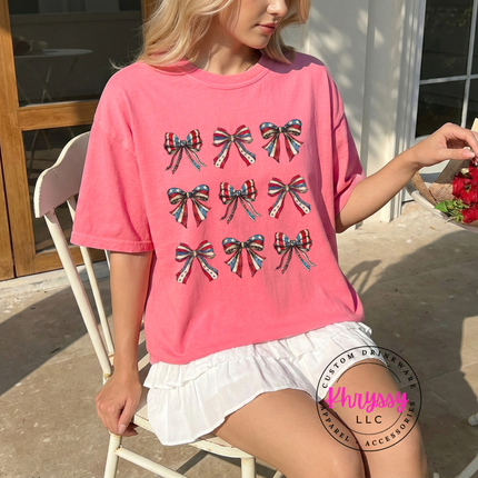 Peony garment-dyed tee showing a coquette patriotic flag-bow grid print.