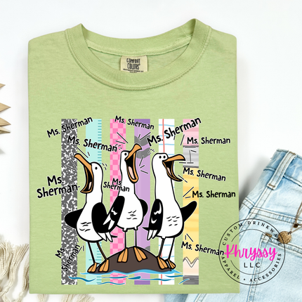Soft Celadon colored teacher shirt featuring three cartoon seagulls shouting a custom name.