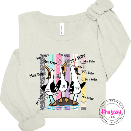Citron colored long sleeve shirt featuring three loud cartoon seagulls and a custom name.