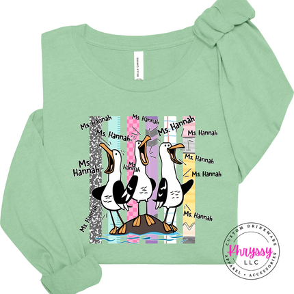 Mint colored long sleeve tee showing the custom name seagull print up close.