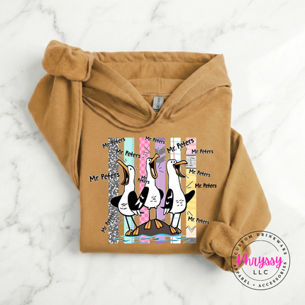 Old Gold colored heavyweight hoodie showing the custom name seagull print up close.