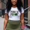 A woman wearing a "Pinch Proof" St. Patrick's Day t-shirt with shamrock design.