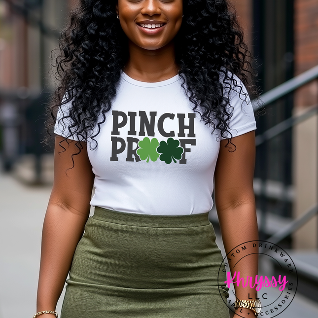 A woman wearing a "Pinch Proof" St. Patrick's Day t-shirt with shamrock design.