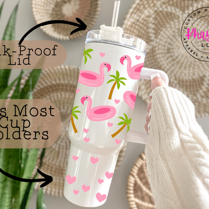 Reusable flamingo travel tumbler with fun vacation-inspired design and a built-in handle for easy carrying.