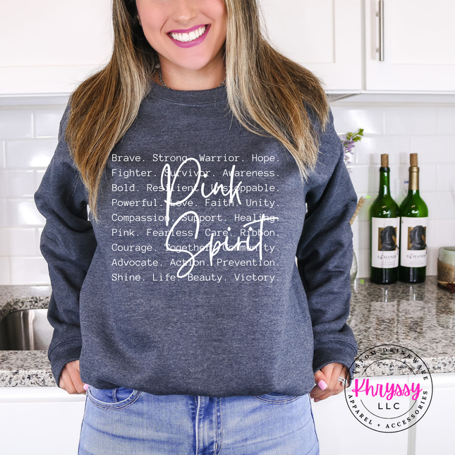 Dark Heather crewneck sweatshirt with the Pink Spirit strength word design in white