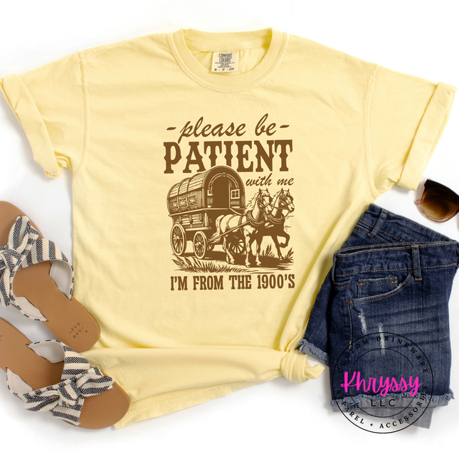 Pigment-dyed vintage humor tee with covered wagon please be patient I'm from 1900s