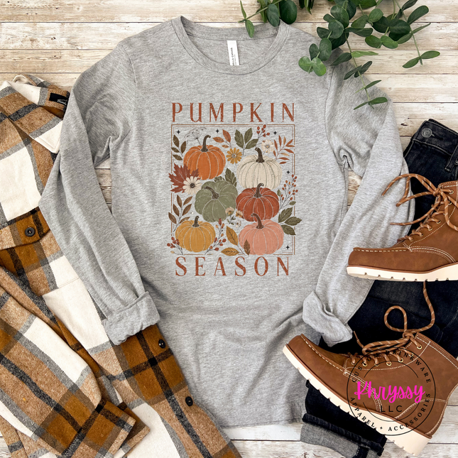 Woman wearing an Athletic Heather top with a blush floral pumpkin block design.