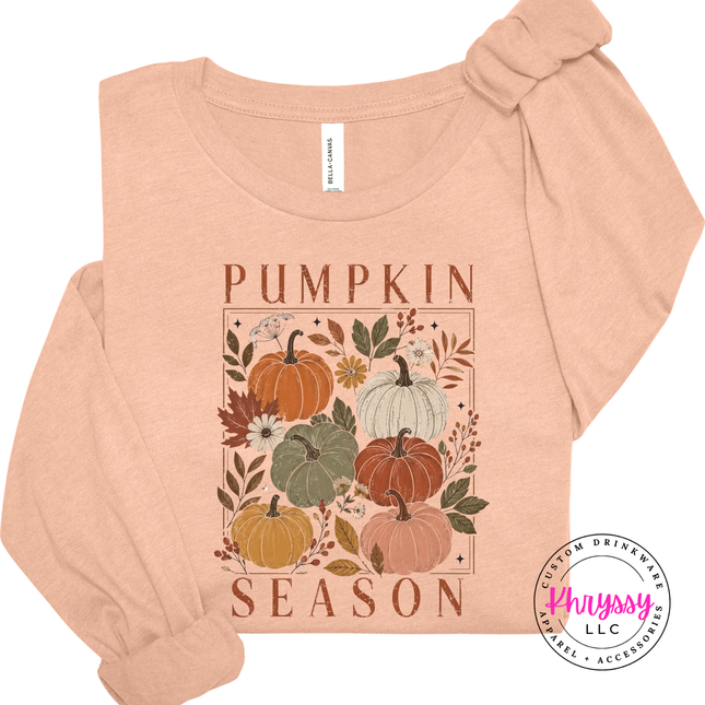 heather peach fitted tee featuring a hand-illustrated pumpkin season floral graphic.