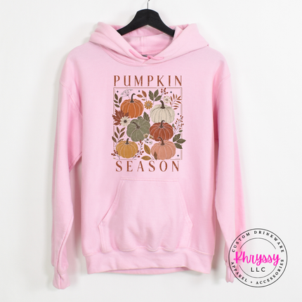 Light Pink hoodie styled for cool weather, featuring a floral pumpkin print.