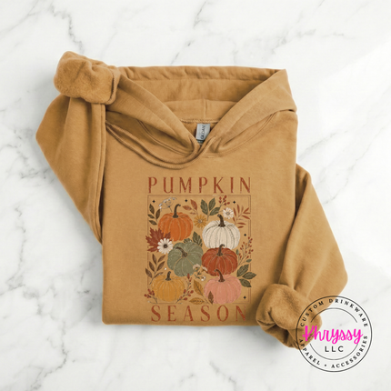 Old gold colored pullover hoodie with a blush and rust pumpkin illustration.