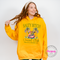 Gold beach hoodie showing a funny salty social club design.