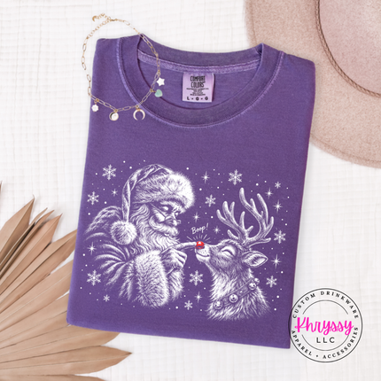 Close up of the Santa and reindeer boop sketch on a Grape long sleeve tee.