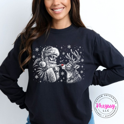 Black long sleeve tee with Santa booping his reindeer on the nose.