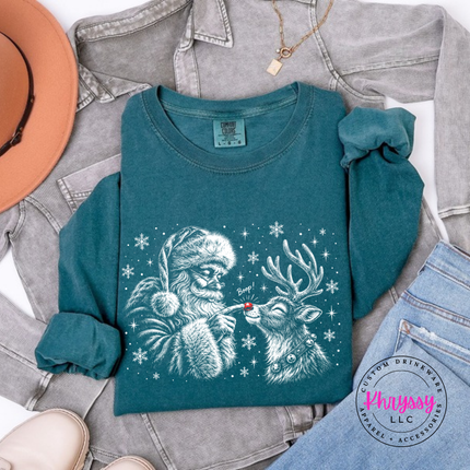 Woman wearing the Santa boop reindeer long sleeve tee in Blue Spruce.