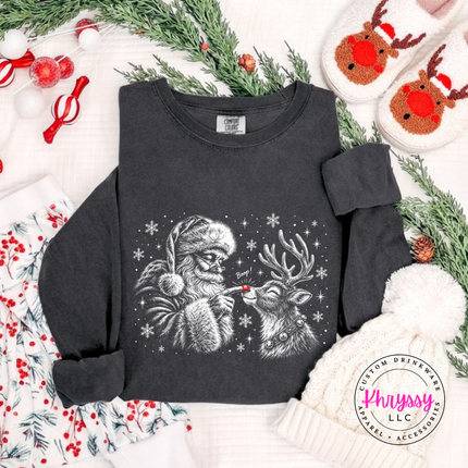 Santa giving his reindeer a nose boop on a Pepper long sleeve tee.