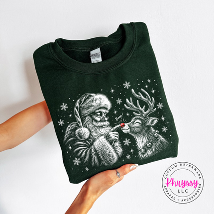Forest crewneck sweatshirt featuring a grinning reindeer and Santa with snowflakes.