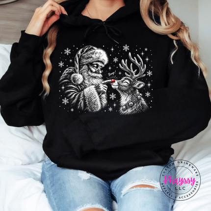 Black hoodie with Santa booping his reindeer on the nose.