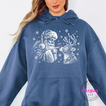 Indigo Blue hoodie featuring a grinning reindeer and Santa with snowflakes.