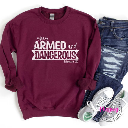 Maroon crewneck with a white She's Armed and Dangerous Ephesians design.