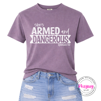 Wine Comfort Colors tee printed with an empowering armed and dangerous design.