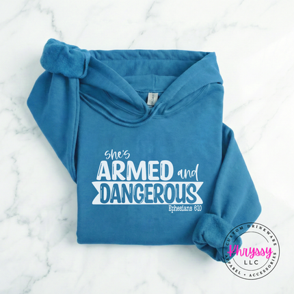 Sapphire heavyweight hoodie printed with an empowering armed and dangerous design.