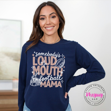Woman wearing a Navy long sleeve tee with the somebody's loud mouth football mama design