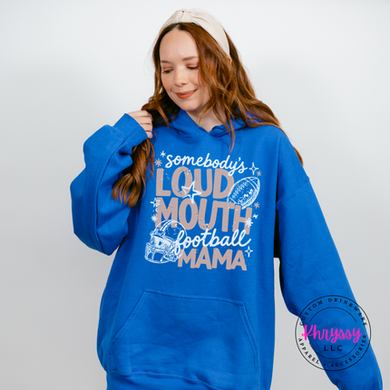 Woman wearing a Royal Blue hoodie with the loud mouth football mama graphic