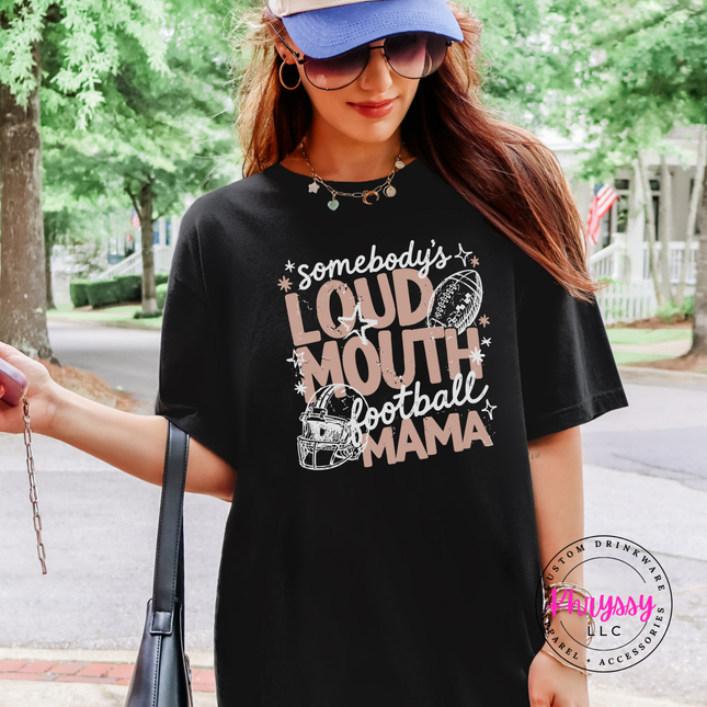 Woman wearing a Black tee with the somebody's loud mouth football mama design