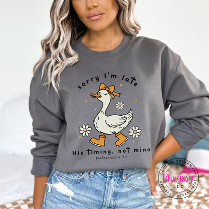Charcoal crewneck sweatshirt with a white Sorry I'm Late goose faith graphic.