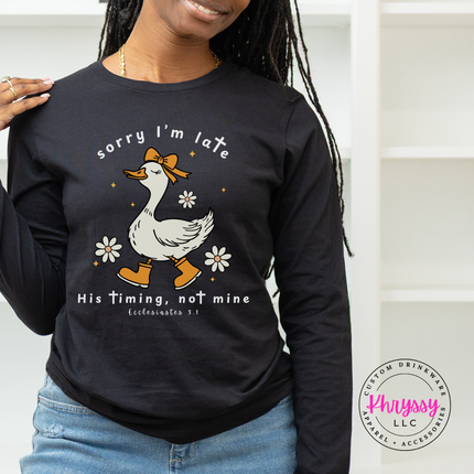 Black long sleeve tee with a white Sorry I'm Late goose faith graphic.
