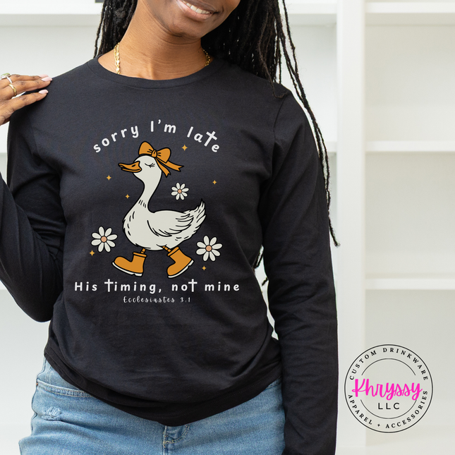 Black long sleeve tee with a white Sorry I'm Late goose faith graphic.