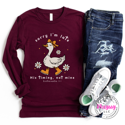 Maroon long sleeve tee showing a white goose and daisies faith graphic.