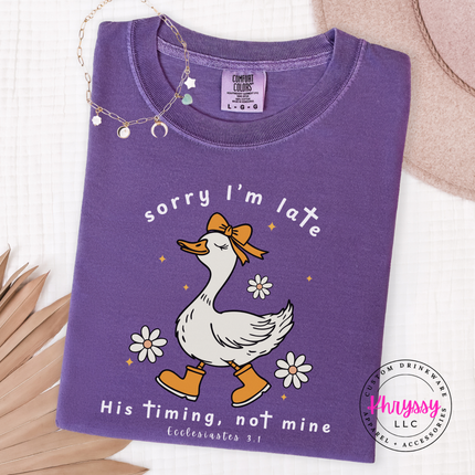 purple garment-dyed tee displaying a white funny faith goose graphic.