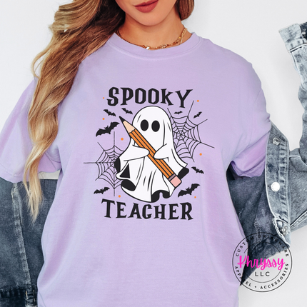 Woman wearing an Orchid tee with the spooky teacher bats and spider web print