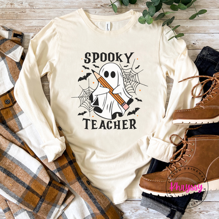 Natural tee featuring a ghost holding a pencil with bats and cobwebs.