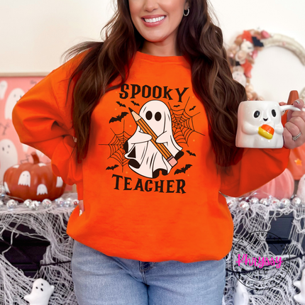 Orange crewneck sweatshirt featuring a ghost holding a pencil with bats.