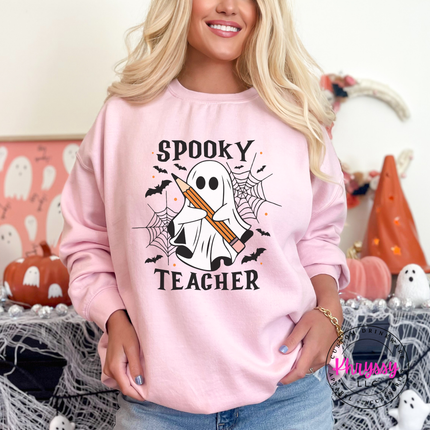 Light pink crewneck sweatshirt with a hand-illustrated spooky teacher print.