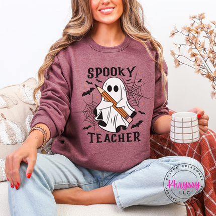Heather dark maroon crewneck sweatshirt with a spooky teacher ghost and pencil print.