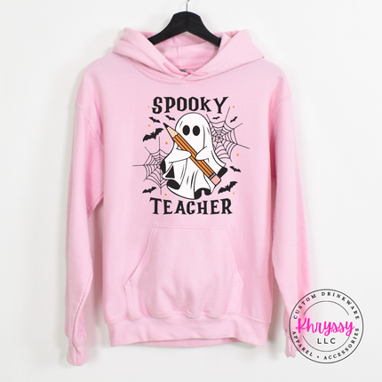 Light pink pullover hoodie with a hand-illustrated spooky teacher print.