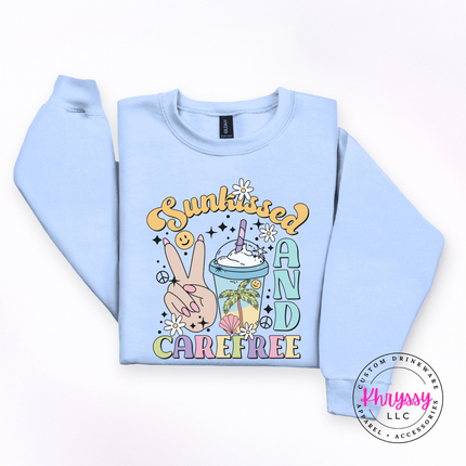 Light Blue crewneck sweatshirt featuring a groovy pastel Sunkissed and Carefree design.