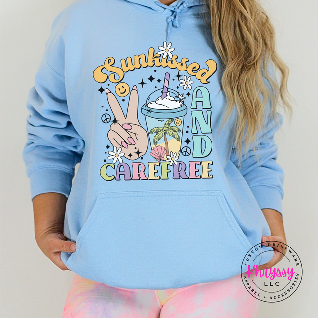 Light Blue pullover hoodie featuring a groovy pastel Sunkissed and Carefree design.