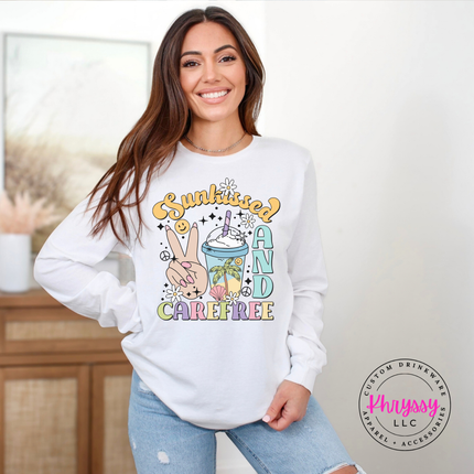 White long sleeve tee displaying a retro pastel Sunkissed and Carefree design.