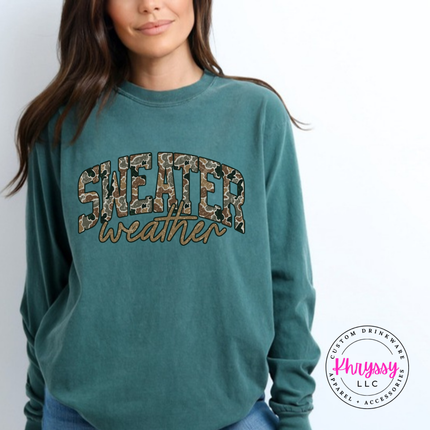 Model wearing the Sweater Weather long sleeve tee in Blue Spruce.