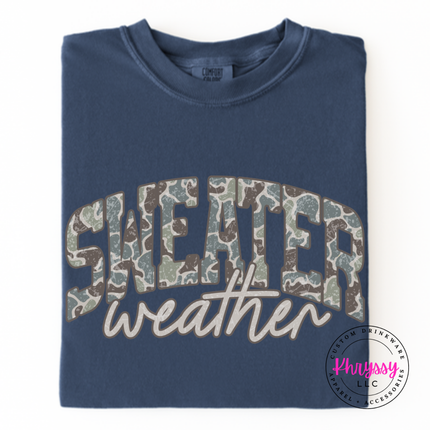 Denim long sleeve tee featuring camo leopard Sweater Weather lettering.